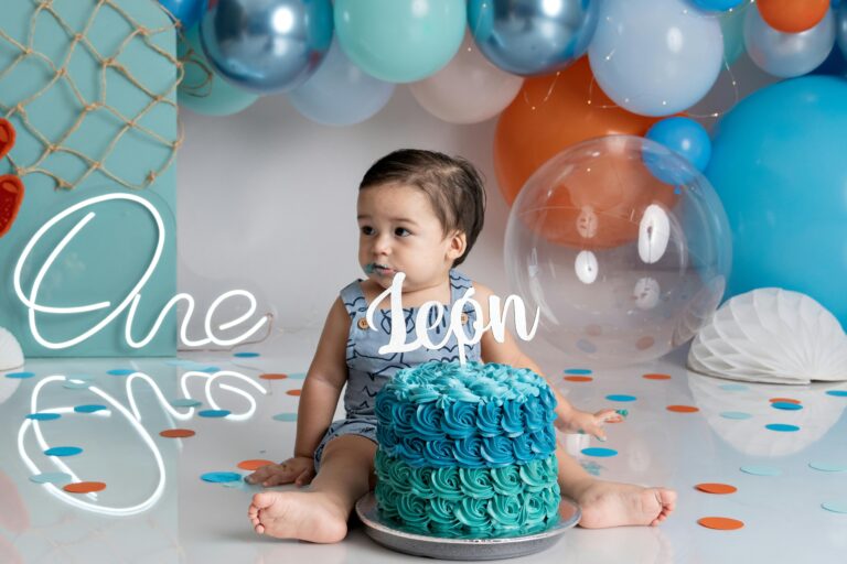 a cute birthday girl with blue cake